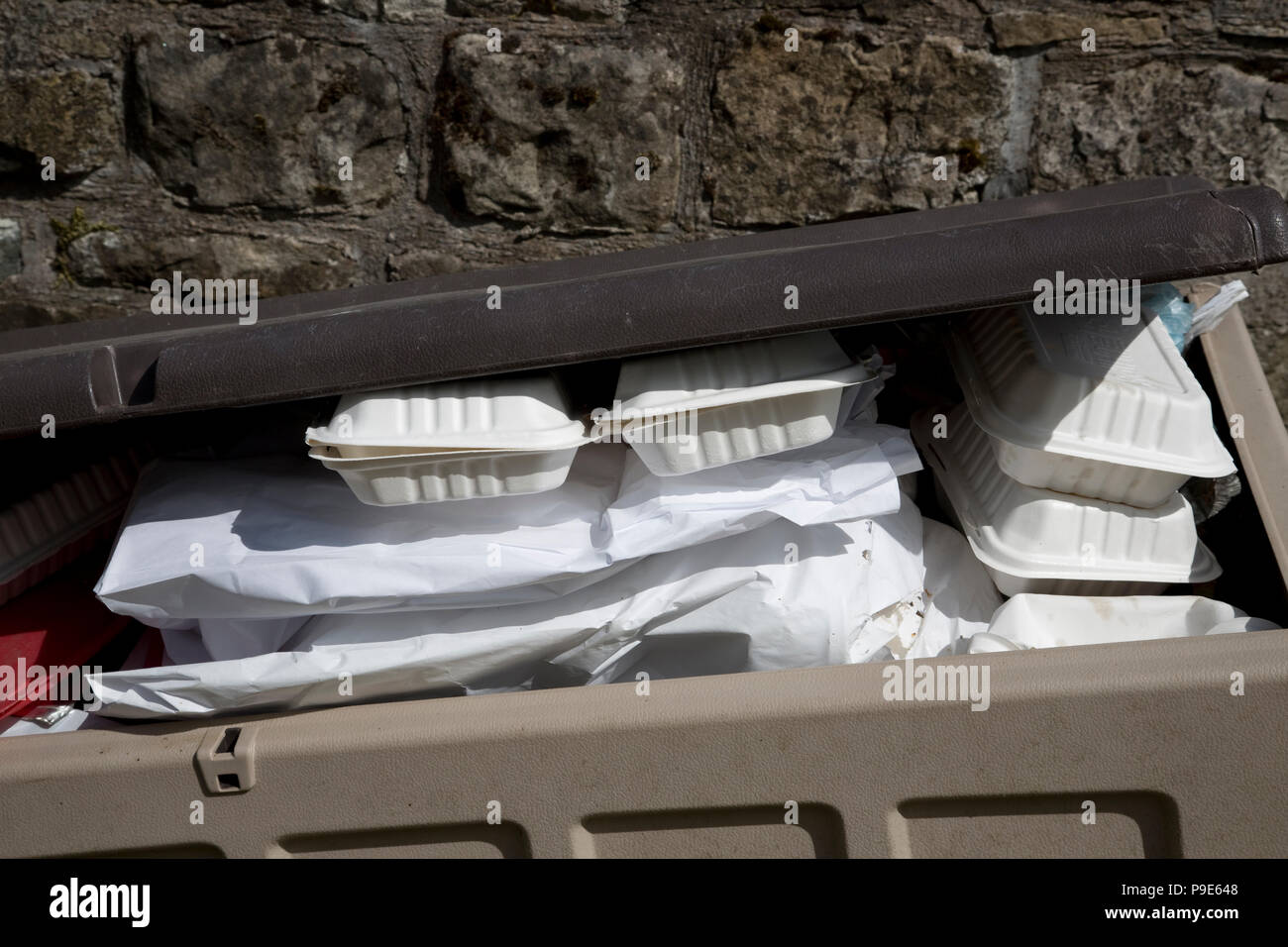 Discarded takeway food packaging in waste bin Scotlandand Stock Photo