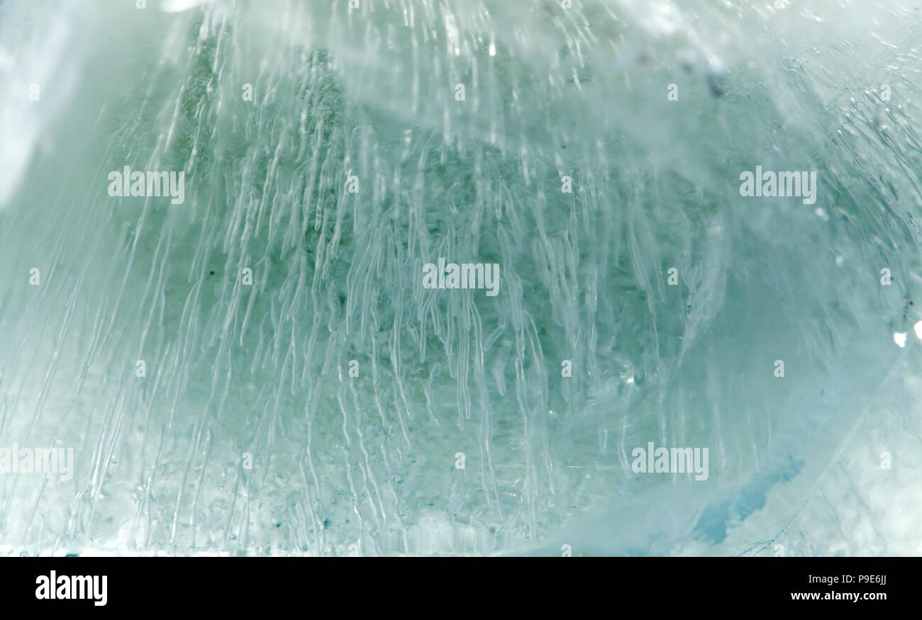 block of ice macro background with visible texture created by air ...