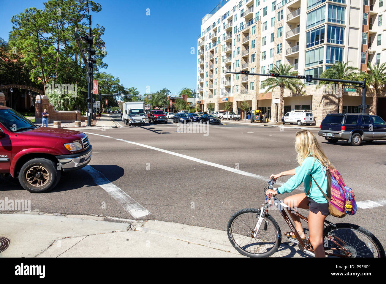 Gainesville Florida,University Avenue,traffic intersection,street crossing,student students education pupil pupils,cycling bicycle bicycles bicycling Stock Photo