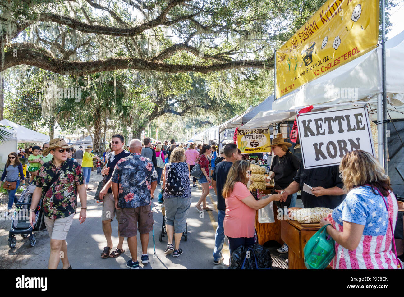 Florida,Micanopy,Fall Harvest Festival,annual small town community event,booths stalls vendors buying selling,crowd,kettle corn,adult adults woman wom Stock Photo