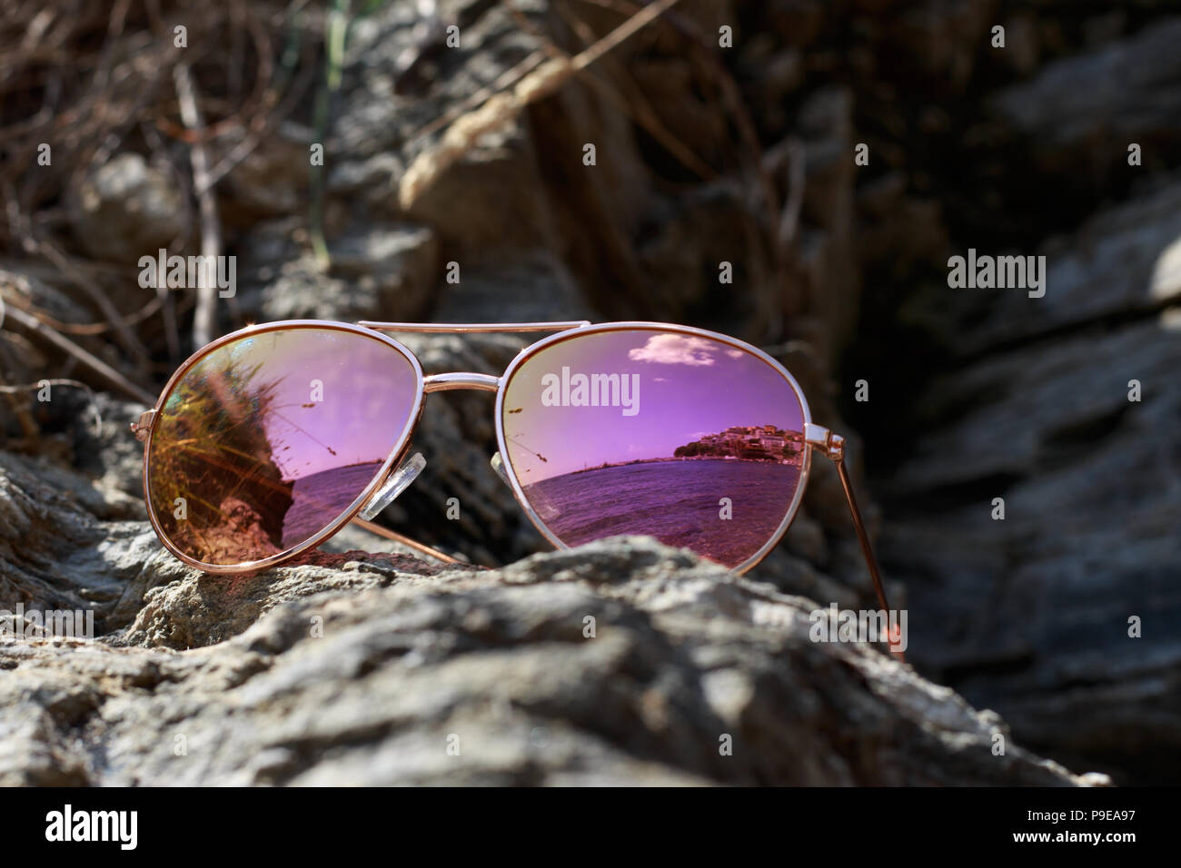Sunglasses at the beach with sea reflection Stock Photo Alamy