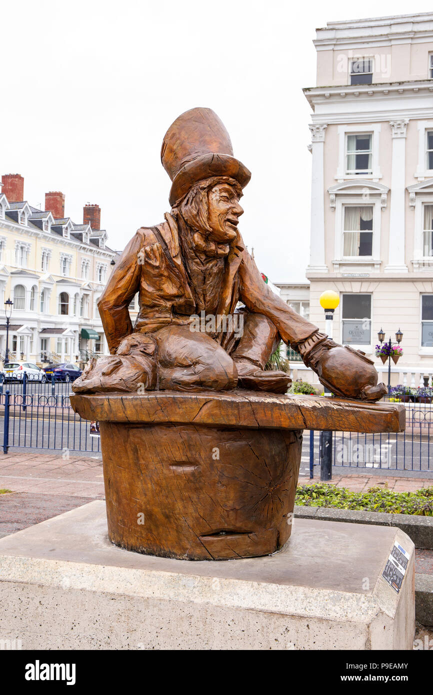 Mad Hatter wooden sculpture on the promenade in Llandudno Wales UK Stock Photo