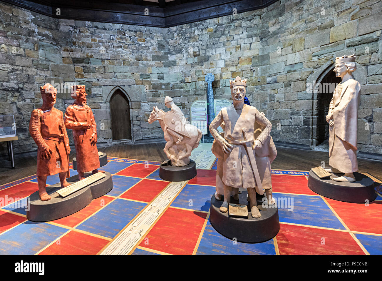Chess piece statues representing historical figures in castle, Caernarvon, Gwynedd, Wales, UK Stock Photo