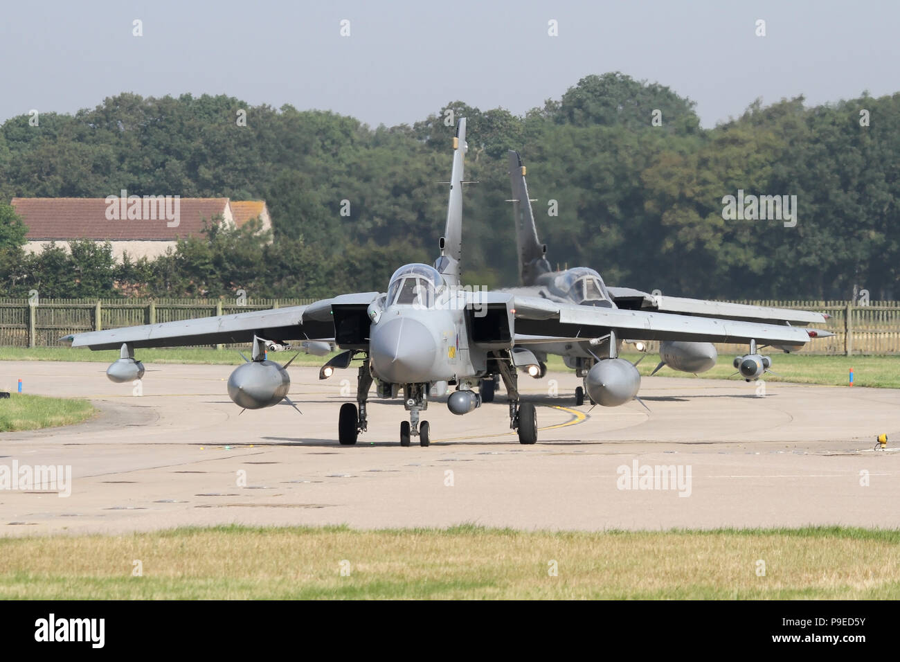 A RAF Tornado leads a RSAF Tornado to the runway at RAF Coningsby during the combined Exercise Green Flag. Stock Photo