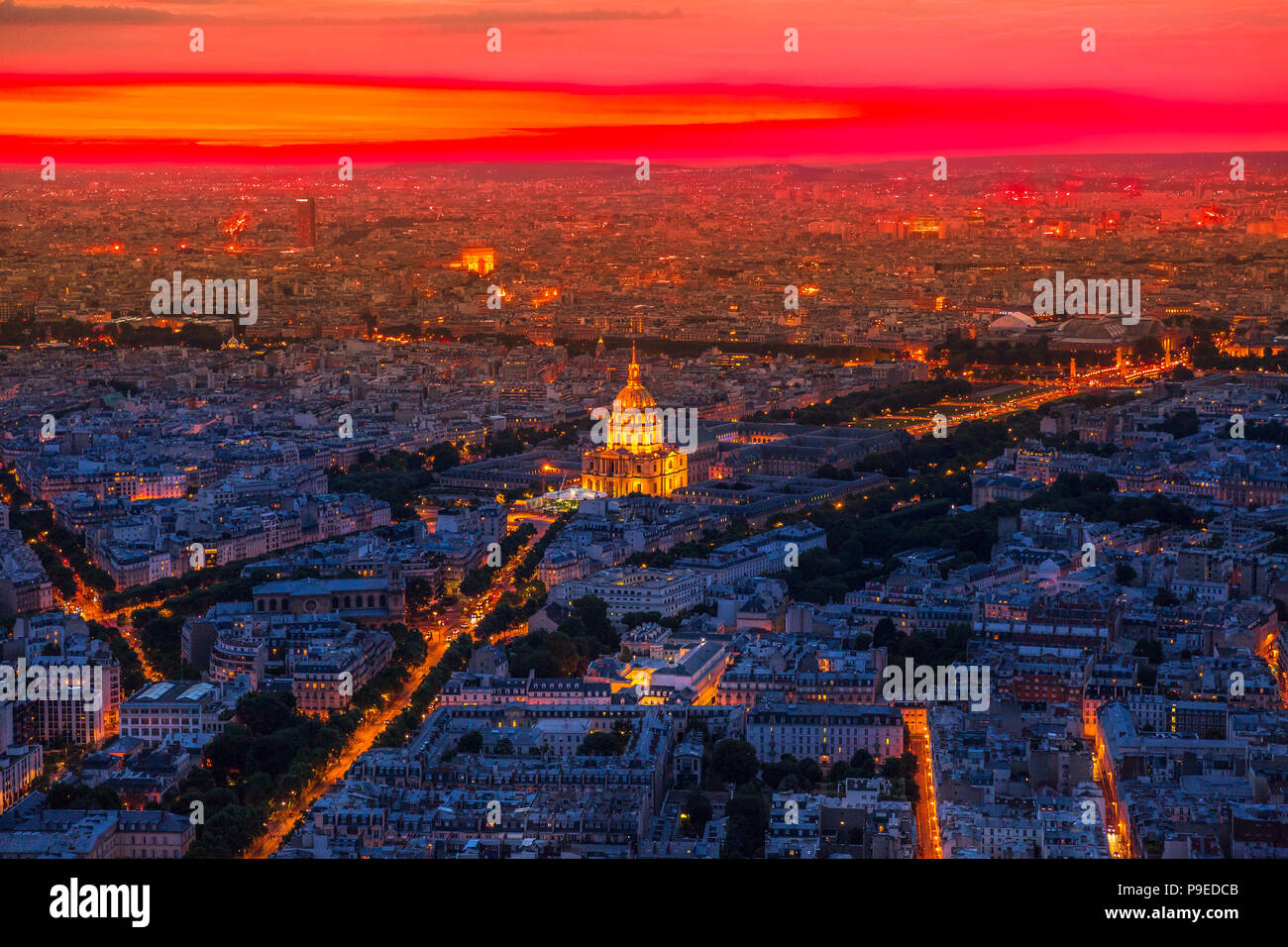 Aerial view of residence of the palace on red sunset with night street light from panoramic terrace of Tour Montparnasse. Paris urban skyline cityscape. European capital of France Stock Photo -