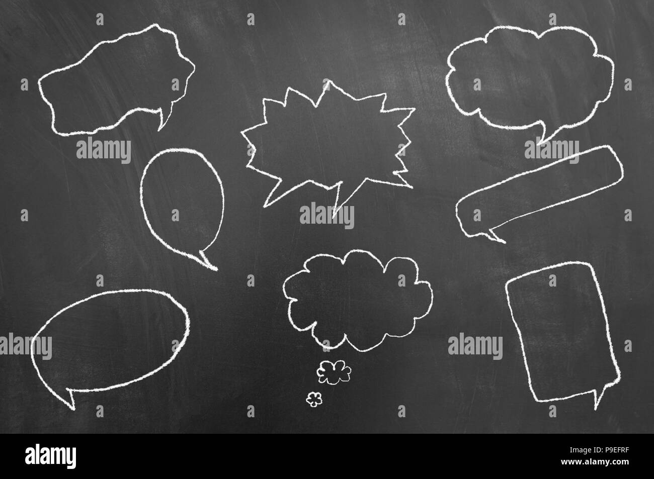 Multiple speech balloons drawing on blackboard or chalkboard as talk balloons with text copy space area concept Stock Photo