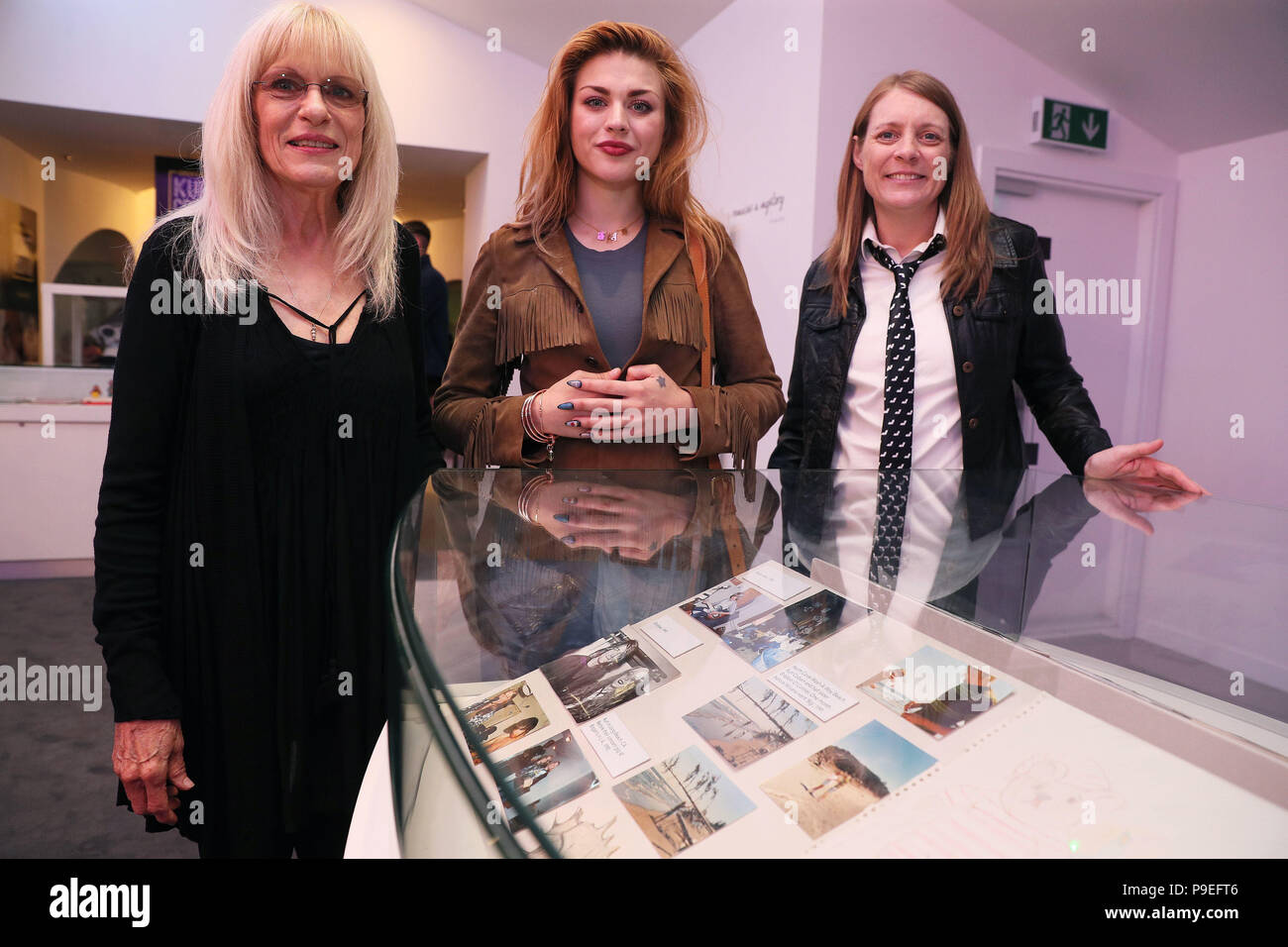 Kurt Cobain's mother Wendy O'Connor (left) daughter Frances Bean Cobain (centre) and sister Kim Cobain stand alongside some of the photographs on display, during the opening of the 'Growing Up Kurt' exhibition on the life of the Nirvana frontman, at the museum of Style Icons in Newbridge, Ireland. Stock Photo