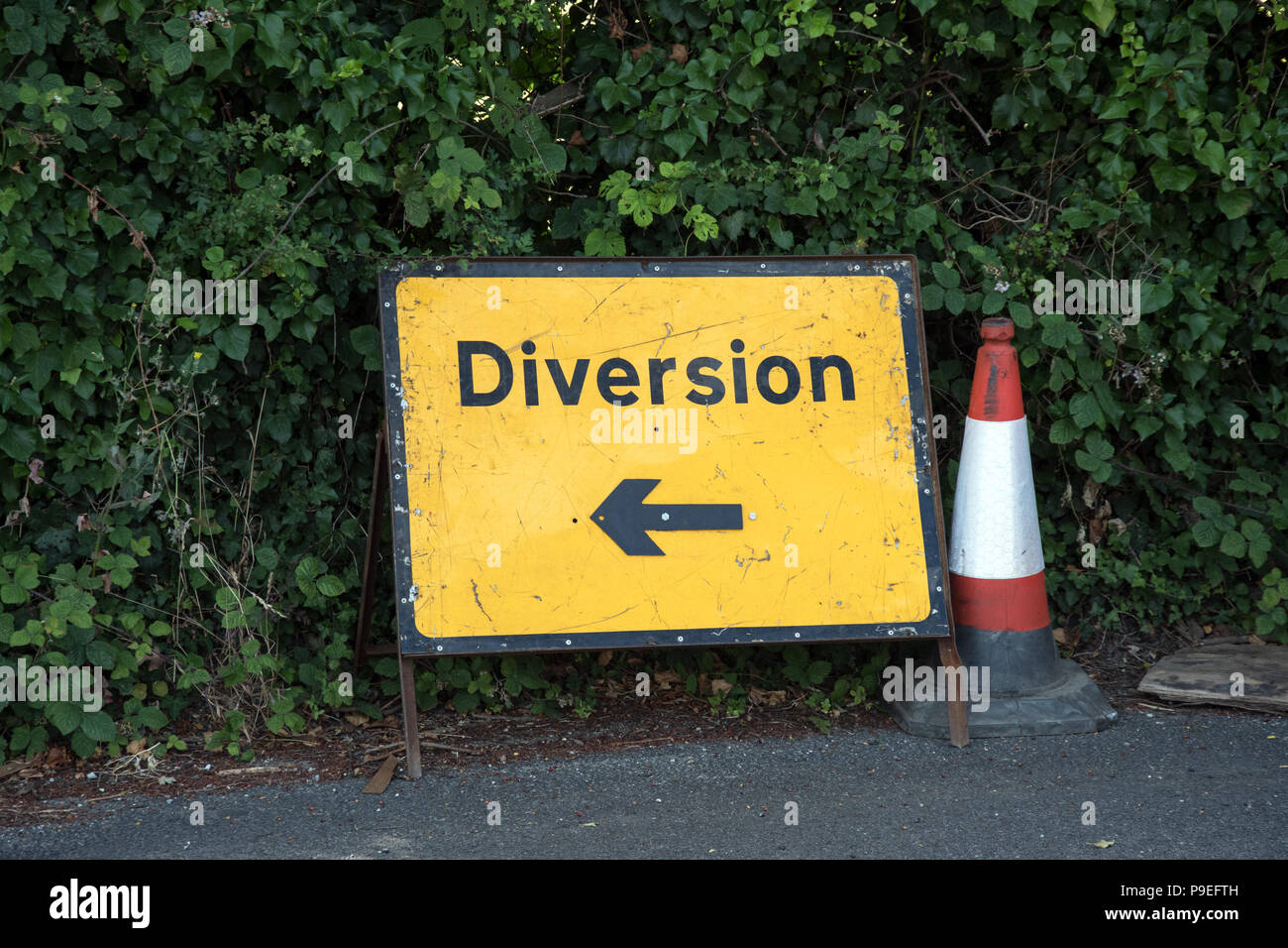 Road diversion sign and traffic cone in the UK Stock Photo