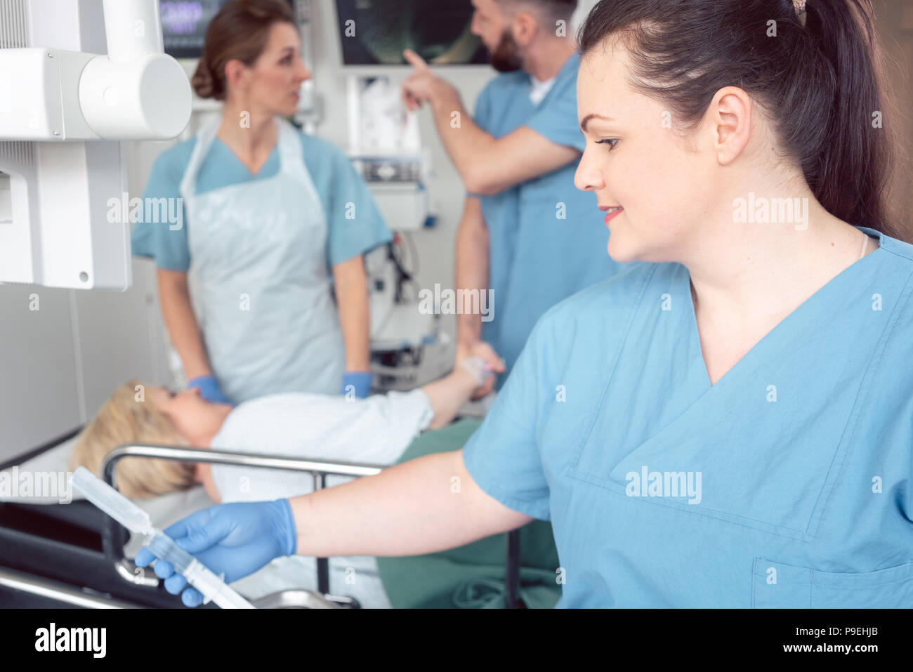 Team of nurses and doctors preparing for endoscopy examination Stock