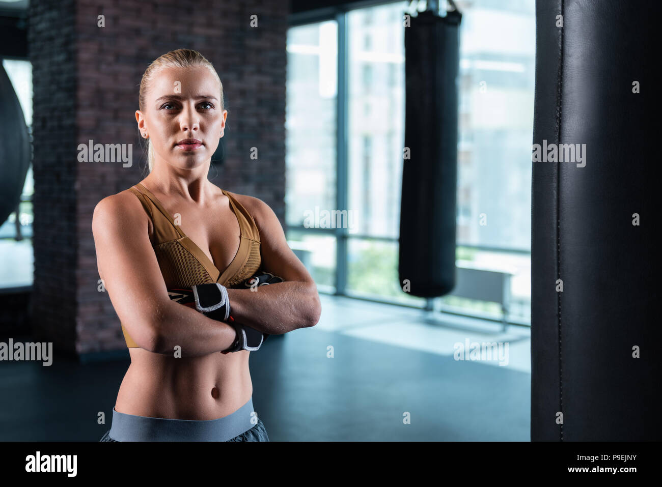 Blonde-haired sport woman wearing gloves Stock Photo
