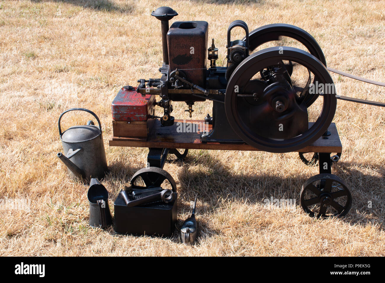 Steam engine with watering can next to it Stock Photo Alamy