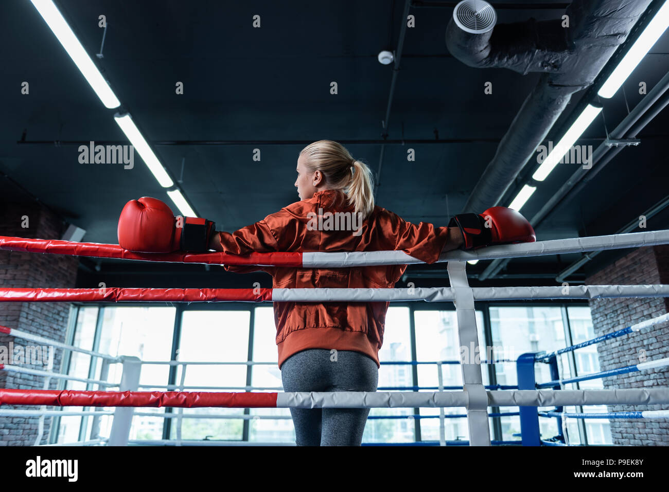 Download Blonde Haired Female Boxer Wearing Grey Leggings And Red Sport Jacket Stock Photo Alamy