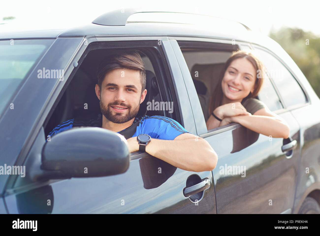 Happy couple traveling by car in the summer. Stock Photo