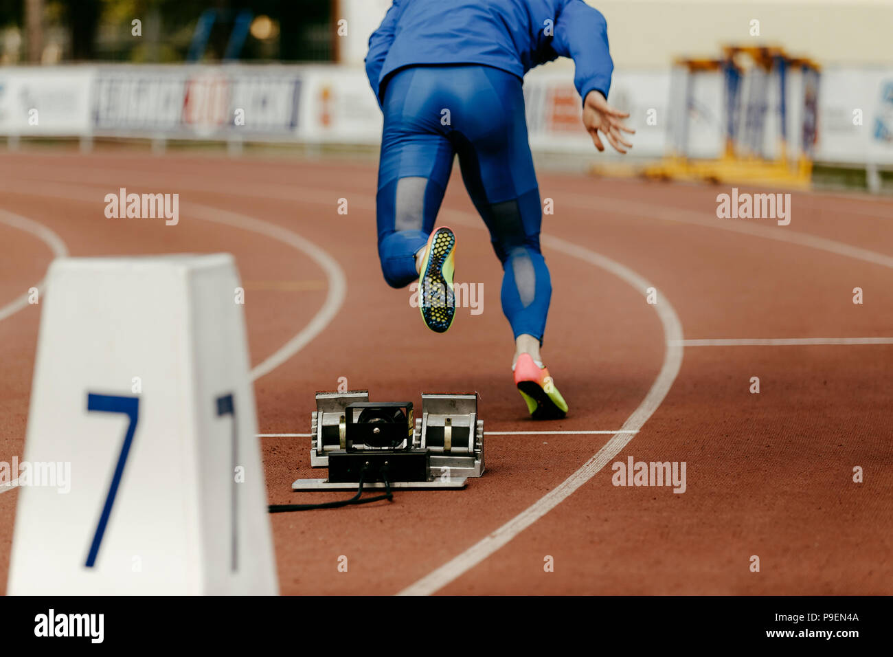 warm-up running start male sprinter runner 200 meter race Stock Photo