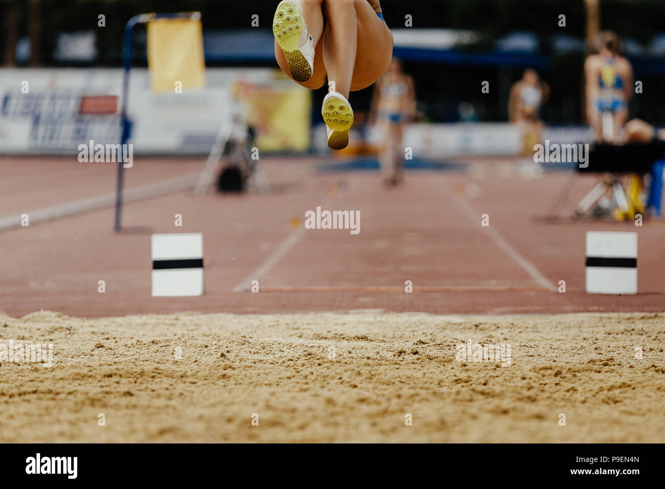 long jump woman legs athlete jumper competition athletics Stock Photo