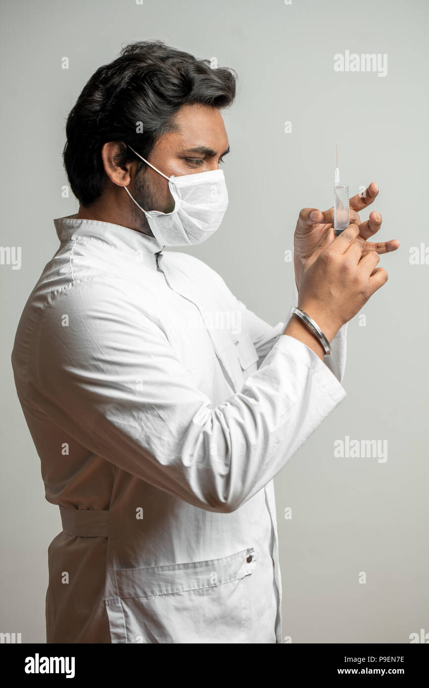 injection before the operation. dentist is giving injection to a