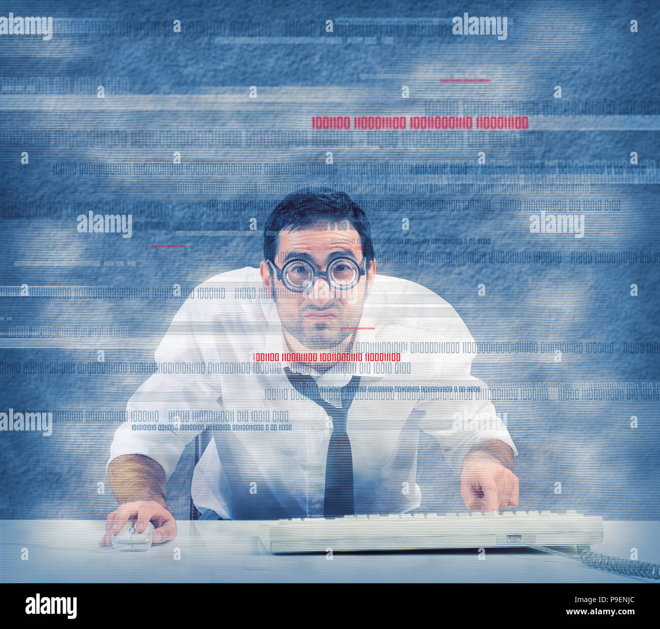 Nerd computer programmer works on a virus program Stock Photo