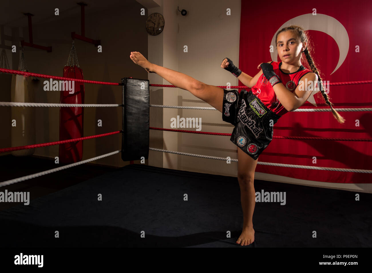 Young girl female junior kick boxer Muay Thai MMA boxing fighter Stock Photo