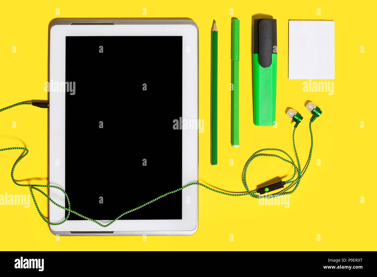 office chancery and gadgets on a yellow surface Stock Photo