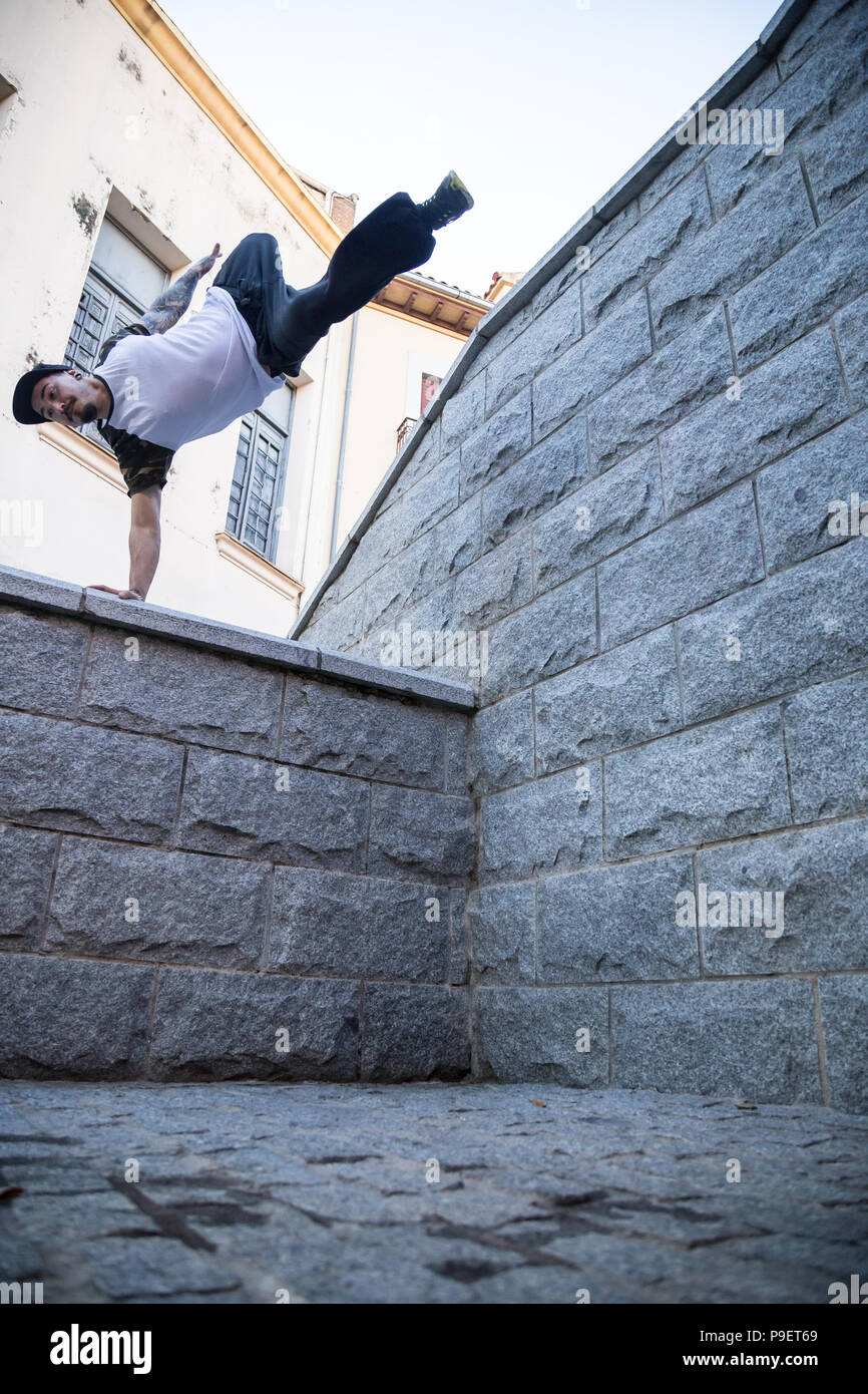 Young man doing an amazing parkour trick on the street Stock Photo - Alamy