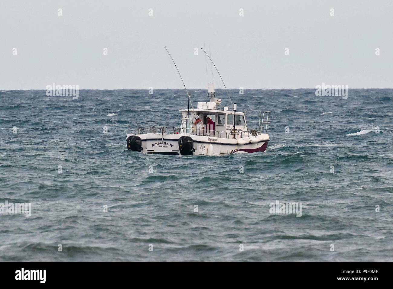 Charmouth, Dorset, UK.  17th July 2018.  The boat Amaretto IV out at sea which is being used for Sharkam during the filming of BBC4's Beach Live, Jurassic Coast Revealed at Charmouth beach in Dorset with presenters historian Dan Snow and natural history experts Lucy Cooke and Niall Strawson.  This was the first one hour live programme of three over 3 evenings which finishes on the 19th July.  Picture Credit: Graham Hunt/Alamy Live News Stock Photo