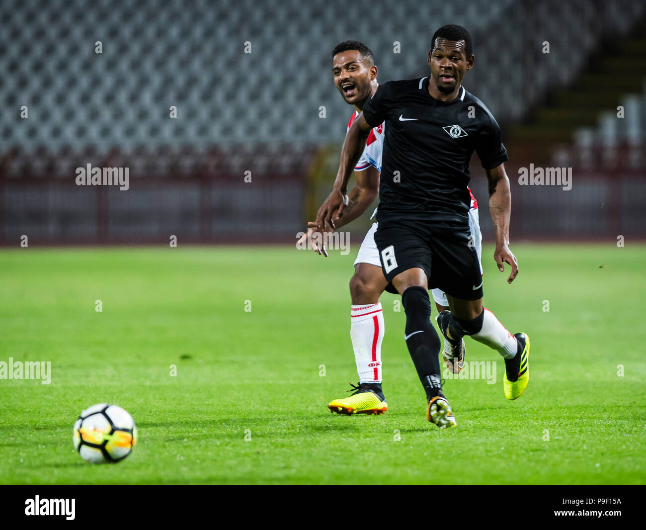 Belgrade, Serbia. 17th July, 2018. Crvena Zvezda's Lorenzo Ebecilio (L)  vies with Spartak's Vitor Silva Honorato during the first qualifying round  UEFA Champions League football match between Crvena Zvezda and Spartaks in