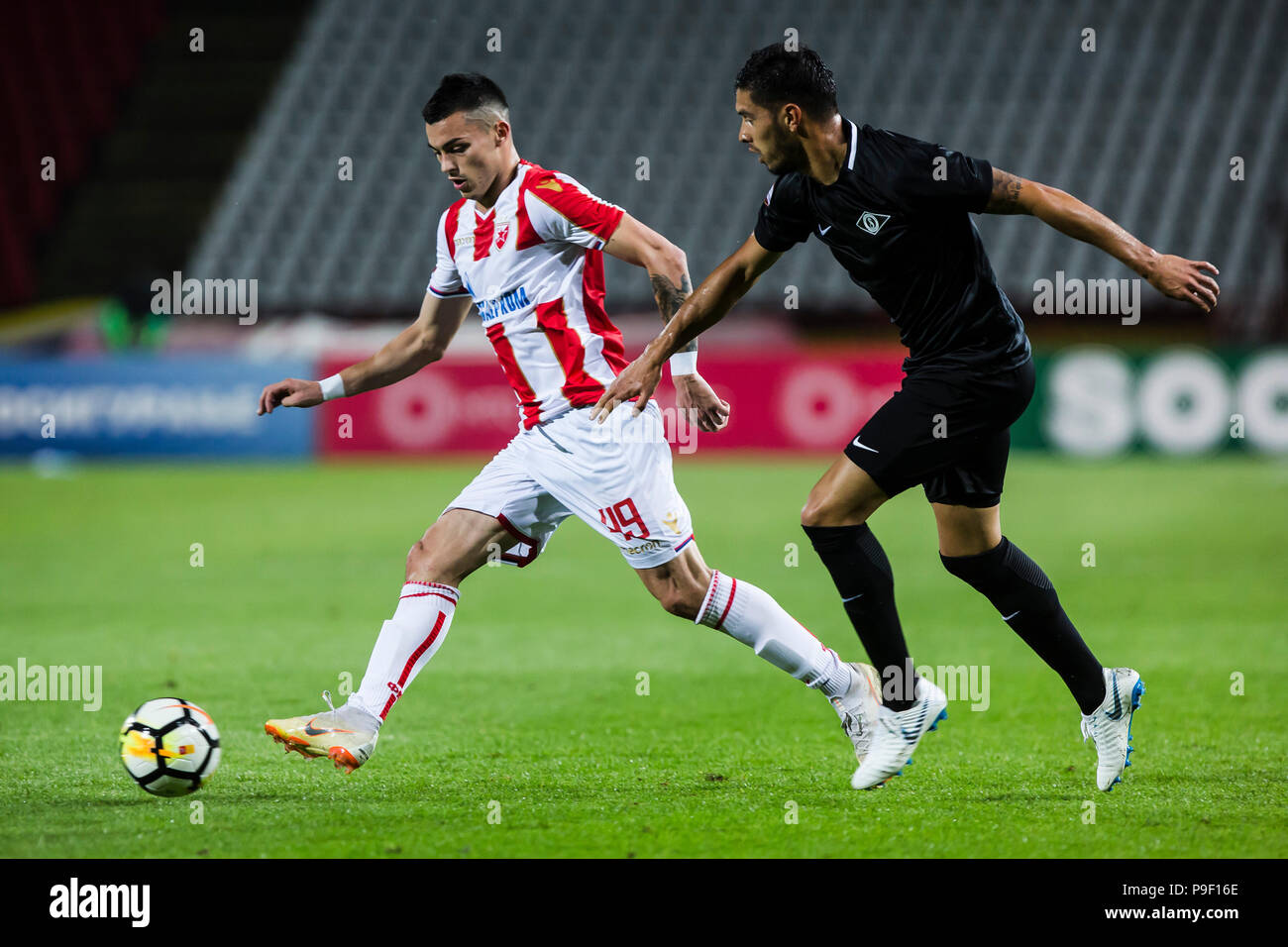 Belgrade, Serbia. 17th July, 2018. Crvena Zvezda's Lorenzo Ebecilio (L)  vies with Spartak's Vitor Silva Honorato during the first qualifying round  UEFA Champions League football match between Crvena Zvezda and Spartaks in