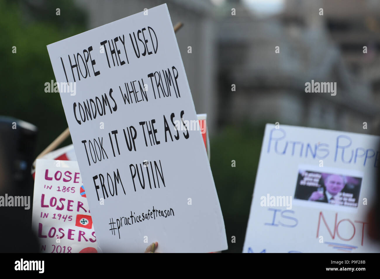 Washington DC, USA. 17th July 2018. Protesters wave their signs during a protest organized by Michael Avenatti in front of the White House, just two days after Donald Trump's gaffs in Helsinki, Finland with Vladimir Putin. Credit: Cal Sport Media/Alamy Live News Stock Photo