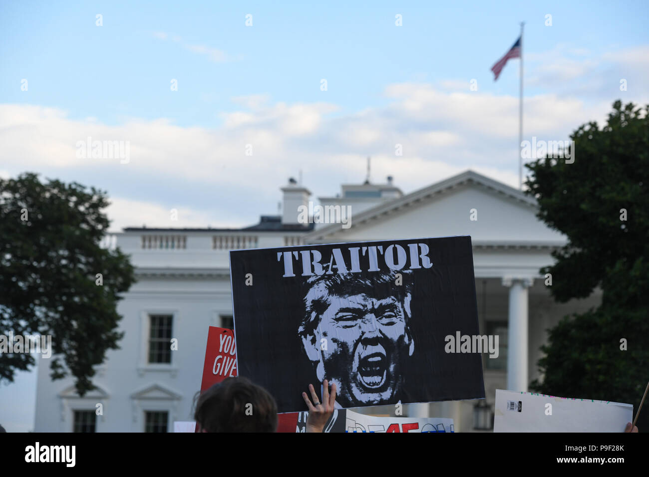 Washington DC, USA. 17th July 2018. Protesters wave their signs during a protest organized by Michael Avenatti in front of the White House, just two days after Donald Trump's gaffs in Helsinki, Finland with Vladimir Putin. Credit: Cal Sport Media/Alamy Live News Stock Photo