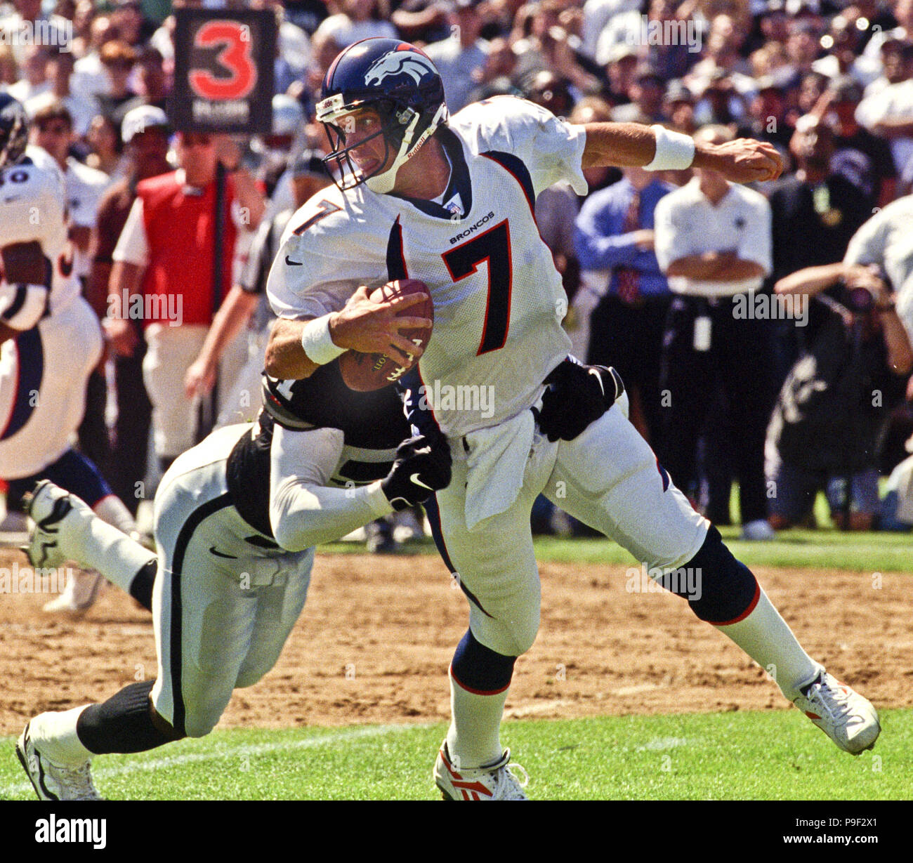 Quarterback John Elway #7 of the Denver Broncos passes the ball down field  against the Los Angeles Raiders.Circa the 1990's. (Icon Sportswire via AP  Images Stock Photo - Alamy