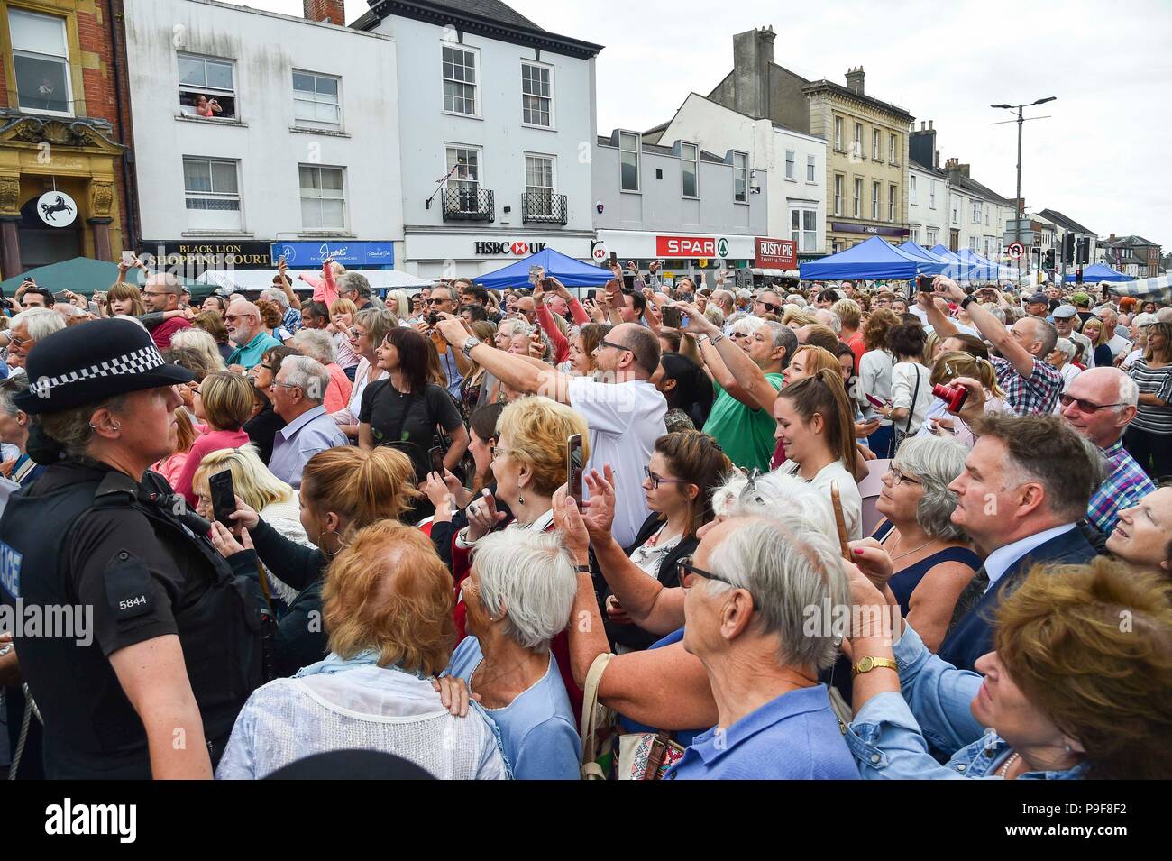 Honiton, Devon, UK.  18th July 2018.   The Duke and Duchess of Cornwall visit the Gate to Plate food market at Honiton in Devon.  Huge crowds turn out to see the royal couple.  Picture Credit: Graham Hunt/Alamy Live News Stock Photo