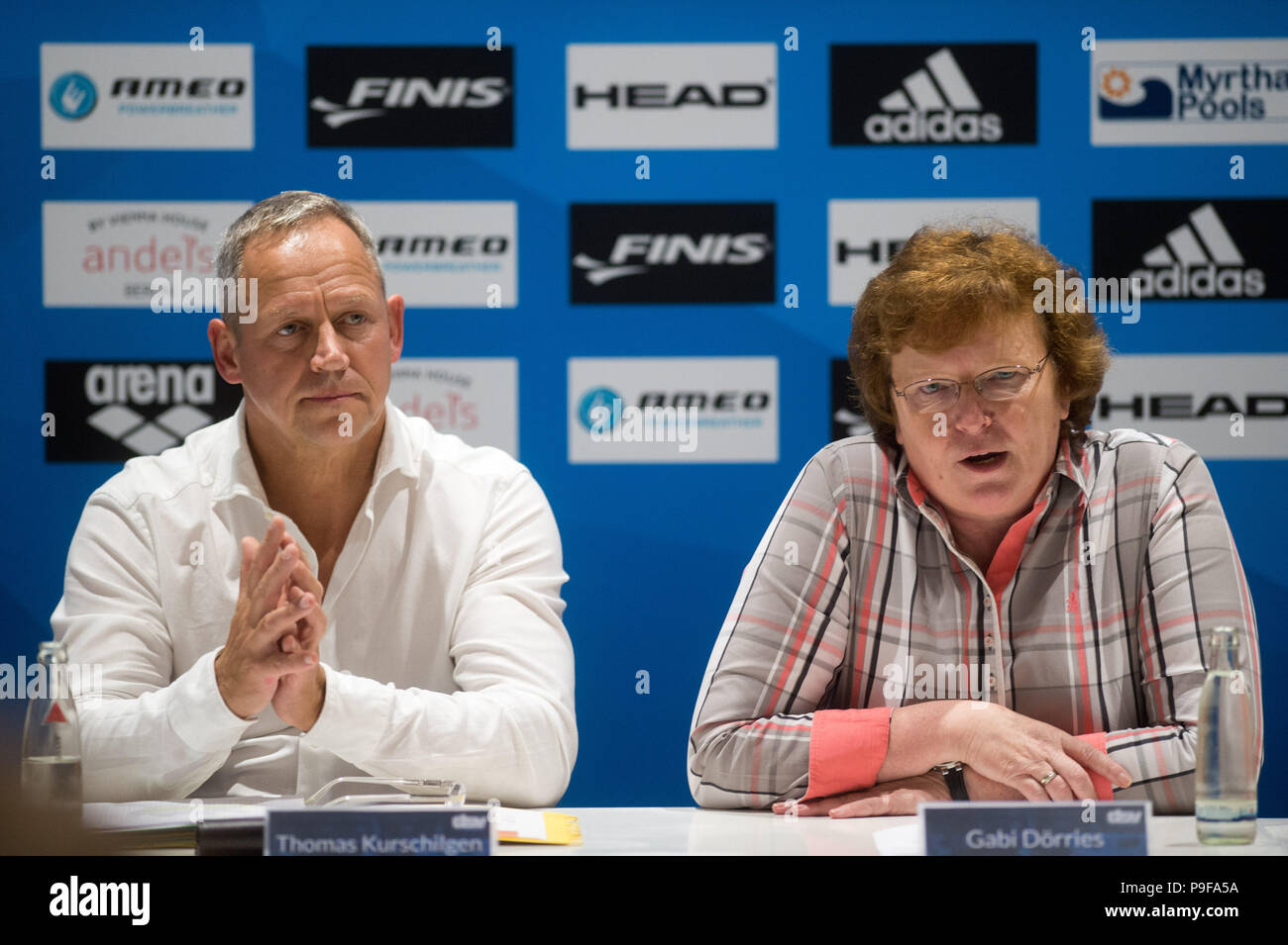Berlin, Germany. 18th July, 2018. Swimming, press conference. Future Performance Sport Director of the German Swimming Association (DSV), Thomas Kurschilgen (L-R) and President of the DSV, Gabi Doerries sitting next to each other during a press conference. The German Swimming Championship is starting on 20 July 2018. Credit: Klaus-Dietmar Gabbert/dpa/Alamy Live News Stock Photo