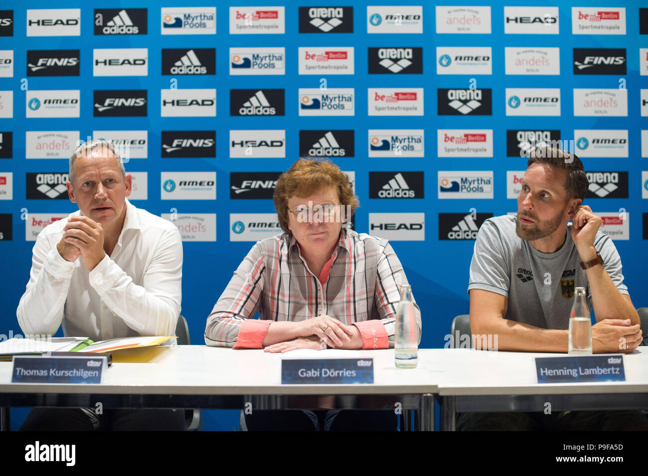 Berlin, Germany. 18th July, 2018. Swimming, press conference. Future Performance Sport Director of the German Swimming Association (DSV), Thomas Kurschilgen (L-R), President of the DSV, Gabi Doerries, and Head National Coach for the DSV, Henning Lambertz, sitting next to each other during a press conference. Credit: Klaus-Dietmar Gabbert/dpa/Alamy Live News Stock Photo