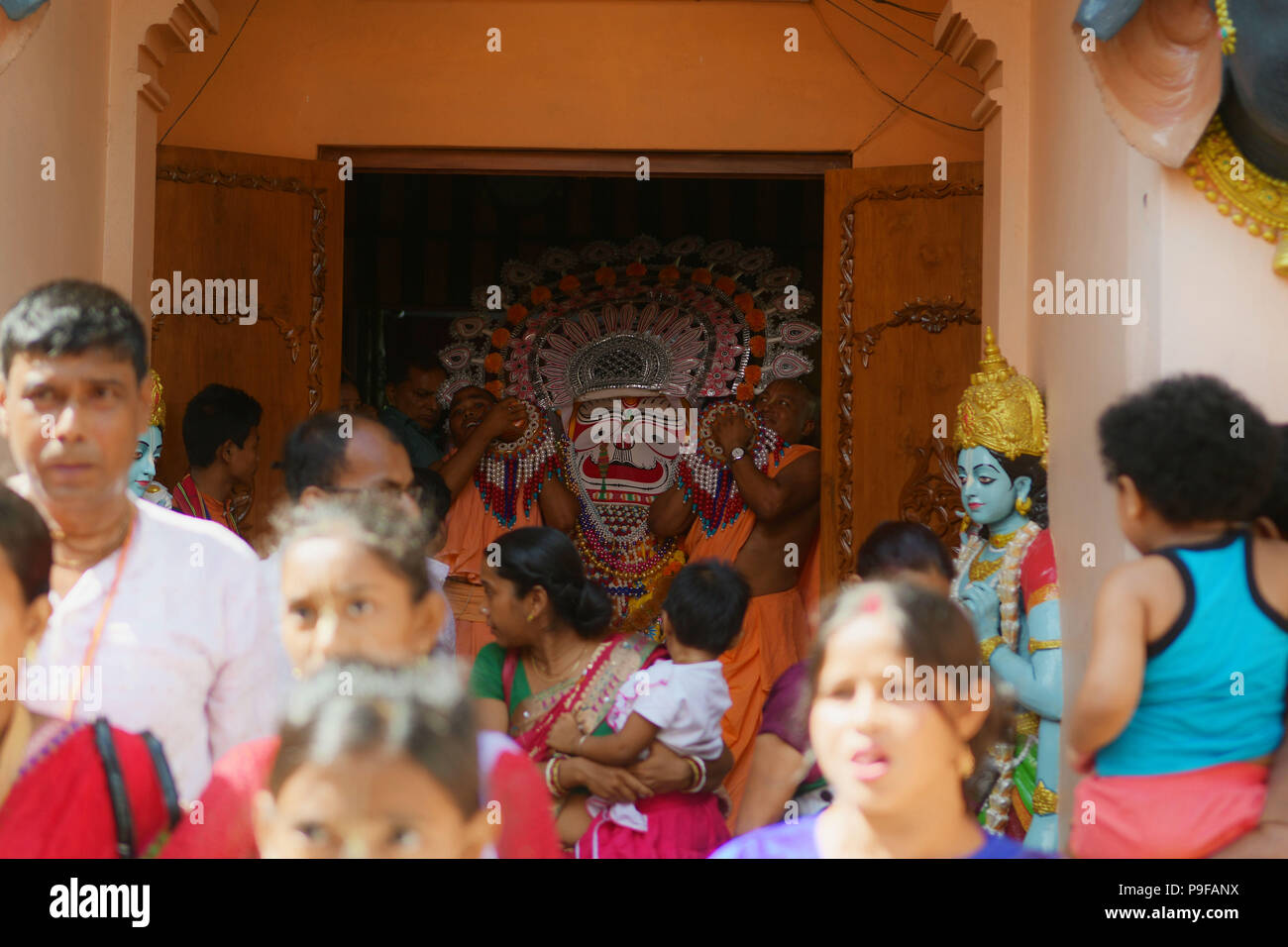 July 14, 2018 - Agartala, Tripura, India - Hindu priests seen carrying the idol out of the temple..Rath Yatra is an annual festival that involves devotees pulling a chariot of lord Jagannatha, his brother Balabhadra and sister Subhadra. (Credit Image: © Abhisek Saha/SOPA Images via ZUMA Wire) Stock Photo
