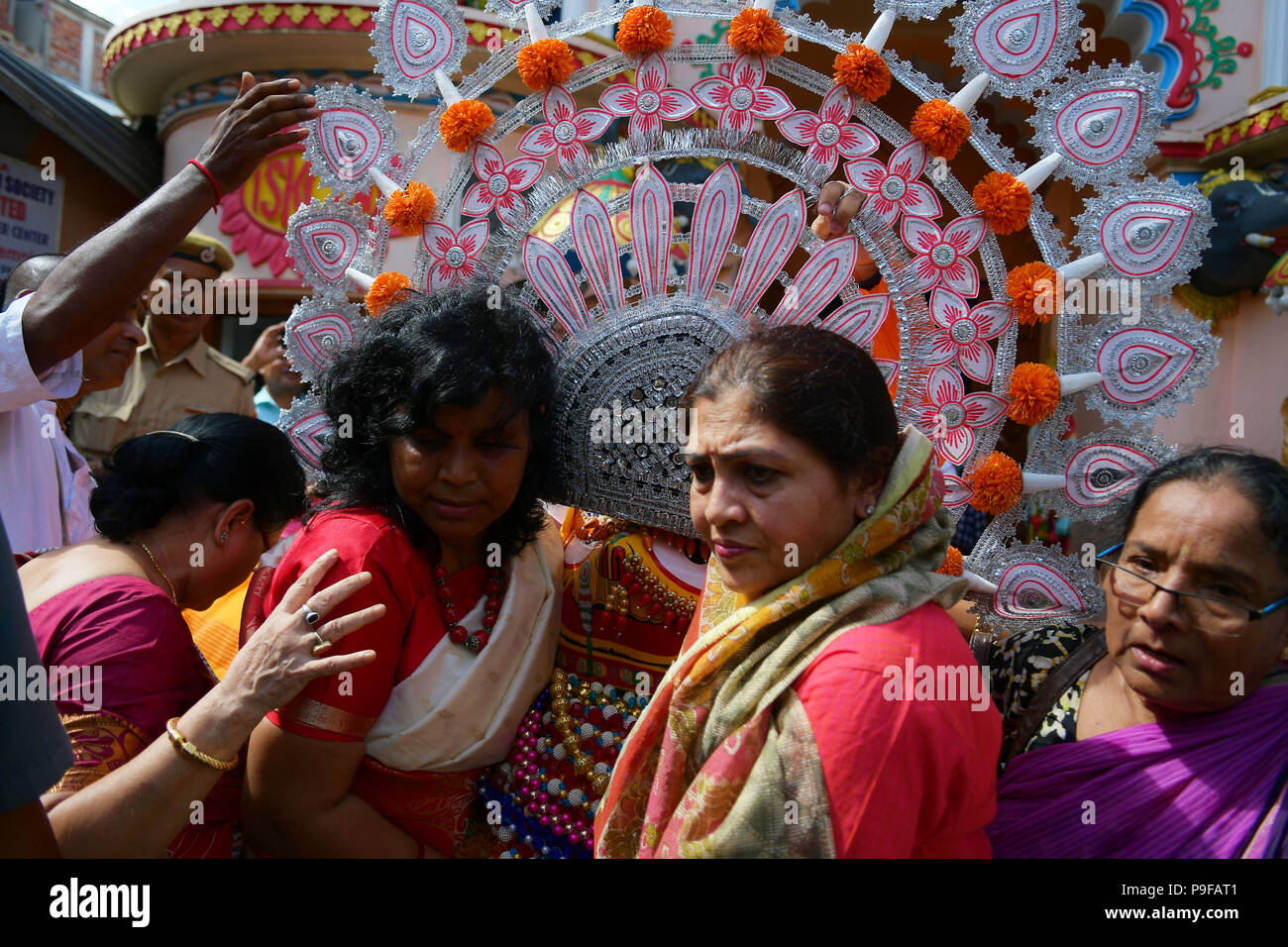 July 14, 2018 - Agartala, Tripura, India - Hindu women seen carrying the idol during the celebrations..Rath Yatra is an annual festival that involves devotees pulling a chariot of lord Jagannatha, his brother Balabhadra and sister Subhadra. (Credit Image: © Abhisek Saha/SOPA Images via ZUMA Wire) Stock Photo