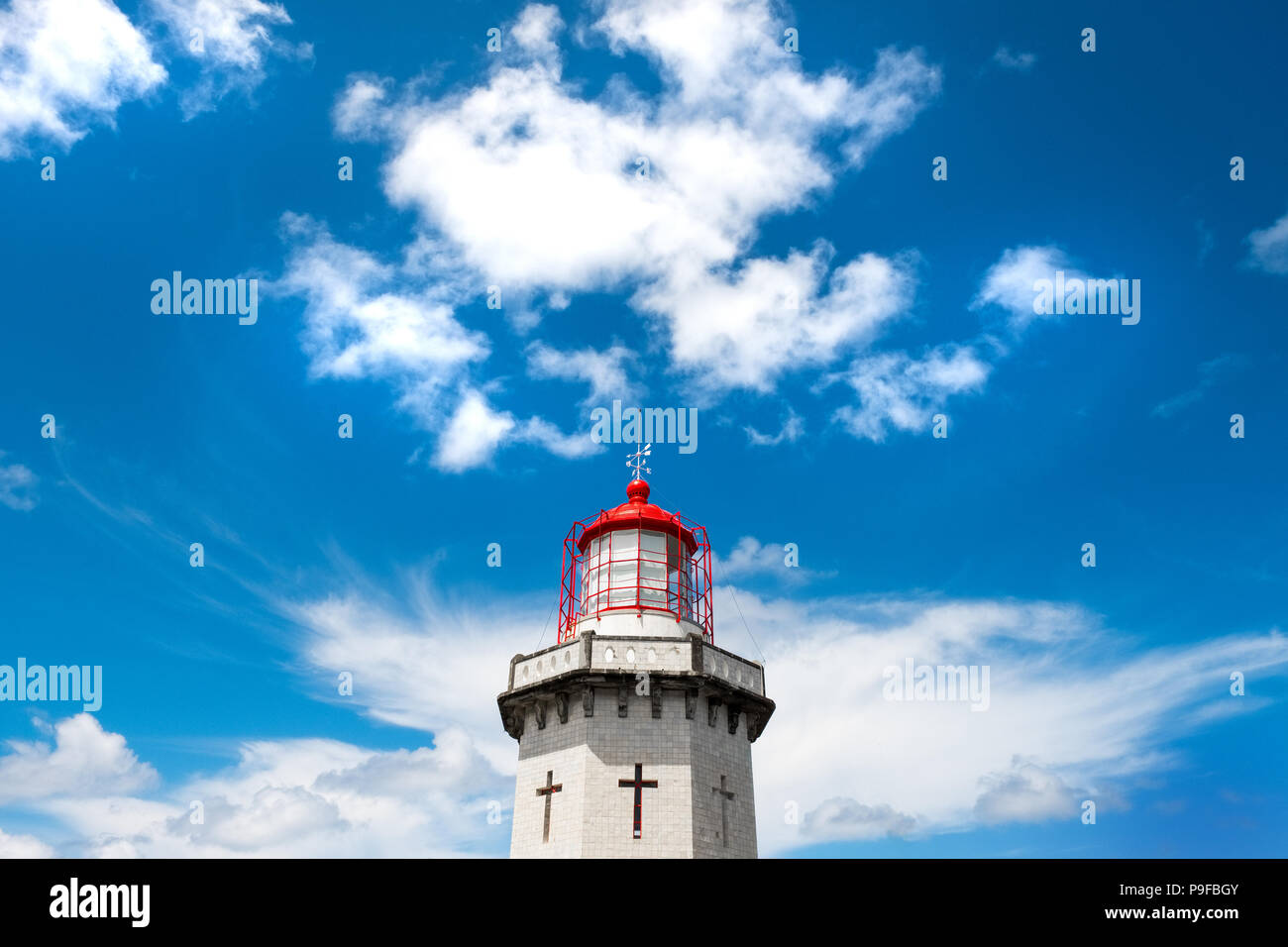 Lighthouse and blue sky on Sao Miguel, The Azores Stock Photo