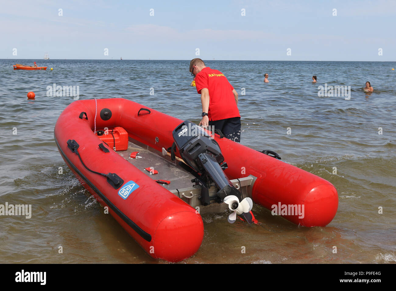 Adam Szawlinski, a 20 y.o. lifeguard who serves on the Baltic Sea beach slipping a motorboat is seen in Gdansk, northern Poland on 6 July 2018 . His 8 Stock Photo