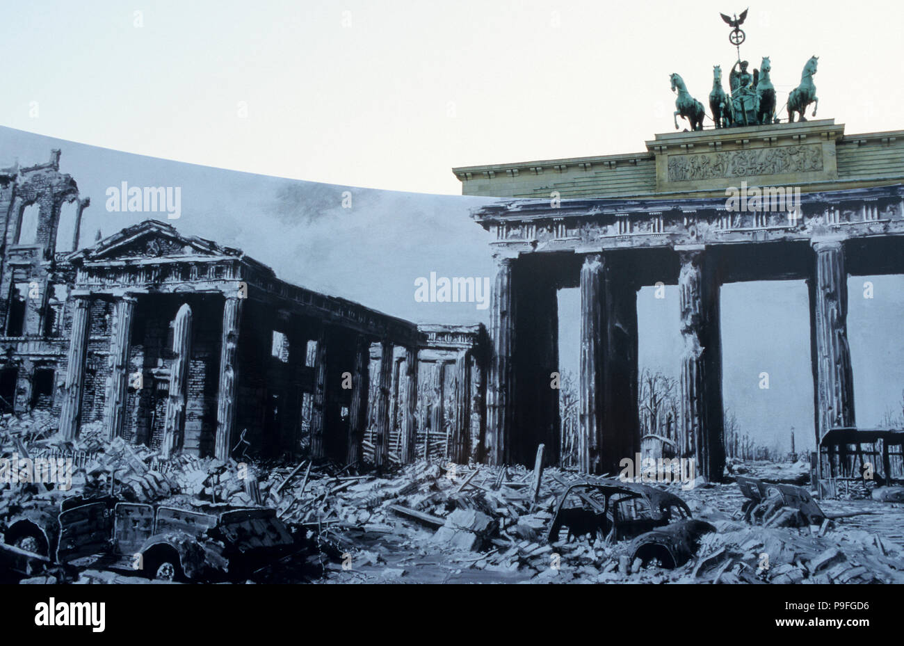 GERMANY, Berlin, Brandenburg Gate with sculpture Quadriga, on top the roman goddess Victoria is riding a horse-powered wagon bringing peace to the town, built 1789-1793, outdoor exhibition with photos from world war II, the gate was till 1989 part of the border and wall between divided east and west Berlin and is today a symbol of reunification, during a visit in Berlin 1987 US president Ronald Reagan said at the gate: 'Mr. Gorbachev, open this gate Mr. Gorbachev, tear down this wall!' Stock Photo