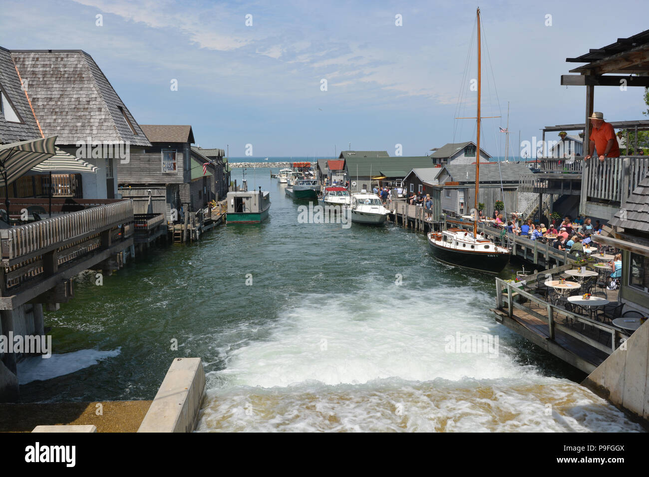 Fishtown in Leland, Michigan is a restored fishing village with shops and restaurants filling the shanties. Stock Photo