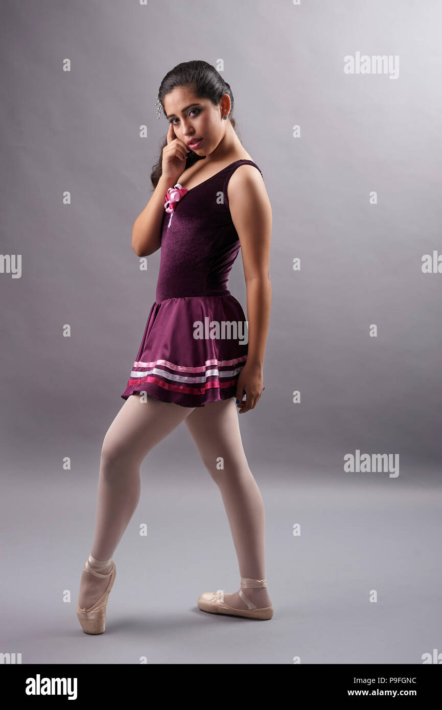 15 years old Mexican teenager girl (XV Años or Quinceañera in spanish) during her birthday photo session, wearing her ballet outfit and pointe shoes Stock Photo