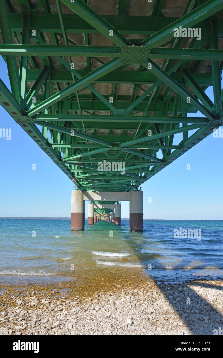 A view of the underneath of the Mackinac Bridge in Mackinaw City, Michigan looking north from the lower peninsula to the upper peninsula. Stock Photo