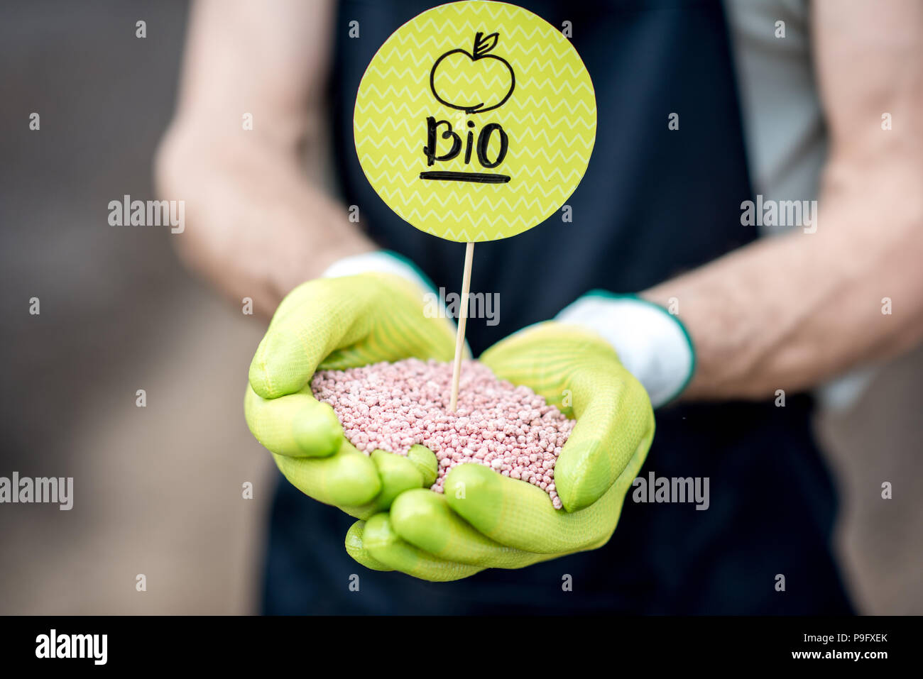 Holding mineral fertilizers Stock Photo