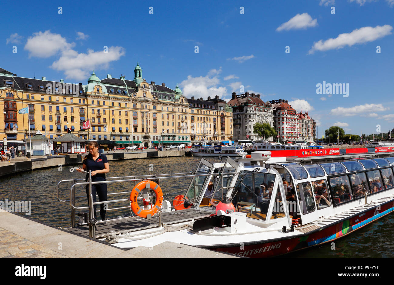 Stockholm, Sweden - July 12, 2018: Sightseeing boat operated by Red sightsseeing hop-on hop-off service at Nybrokajen. Stock Photo