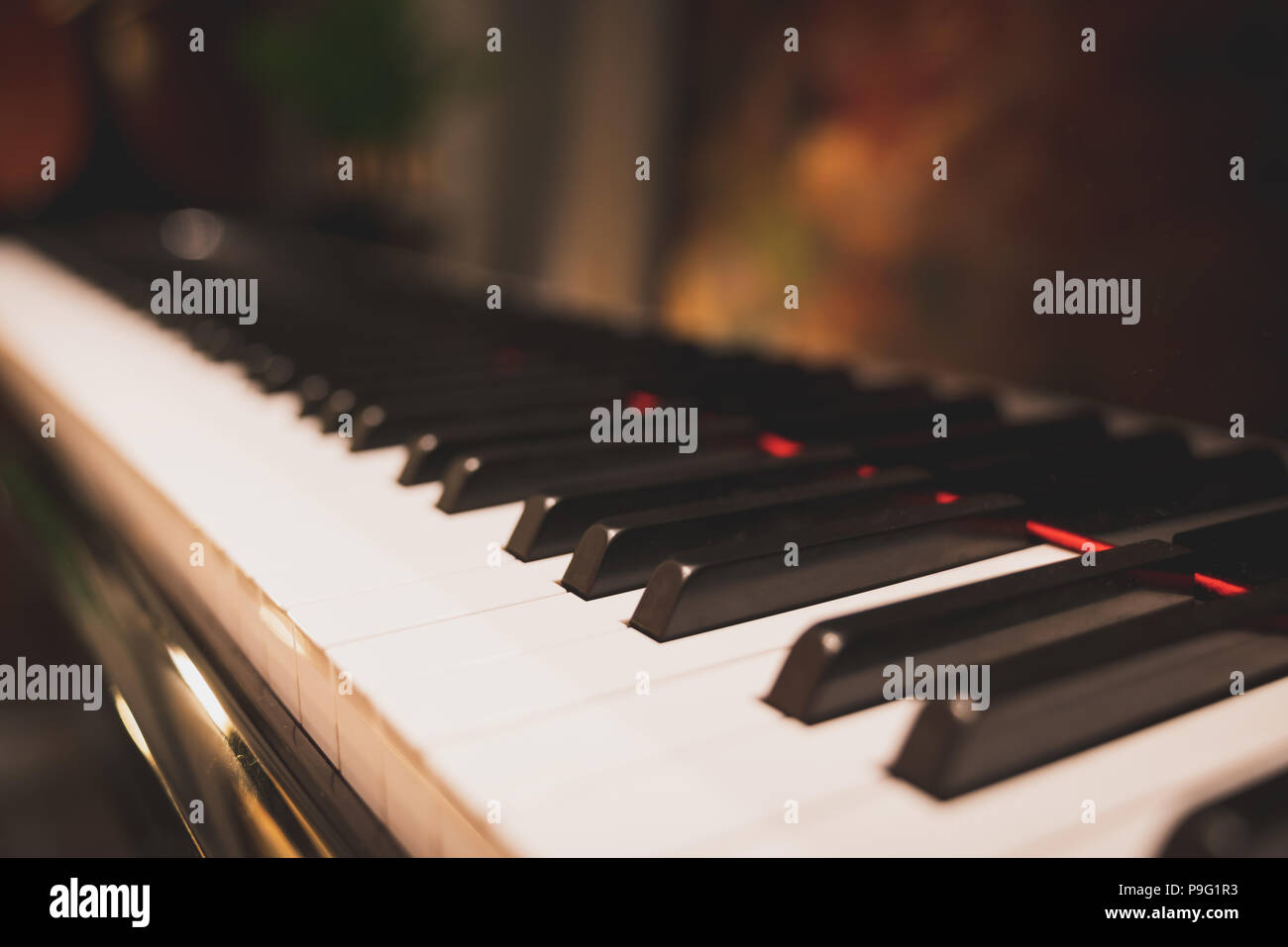 Close-up keyboard of a piano in romantic classic atmosphere. Acoustic music instrument, pianist, song artist composer, hobby, or wedding event concept Stock Photo