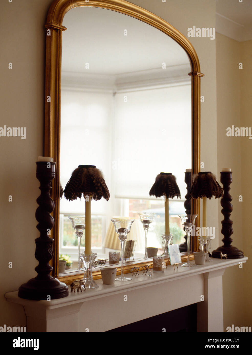 Mirror living room above a mantelpiece hires stock photography and