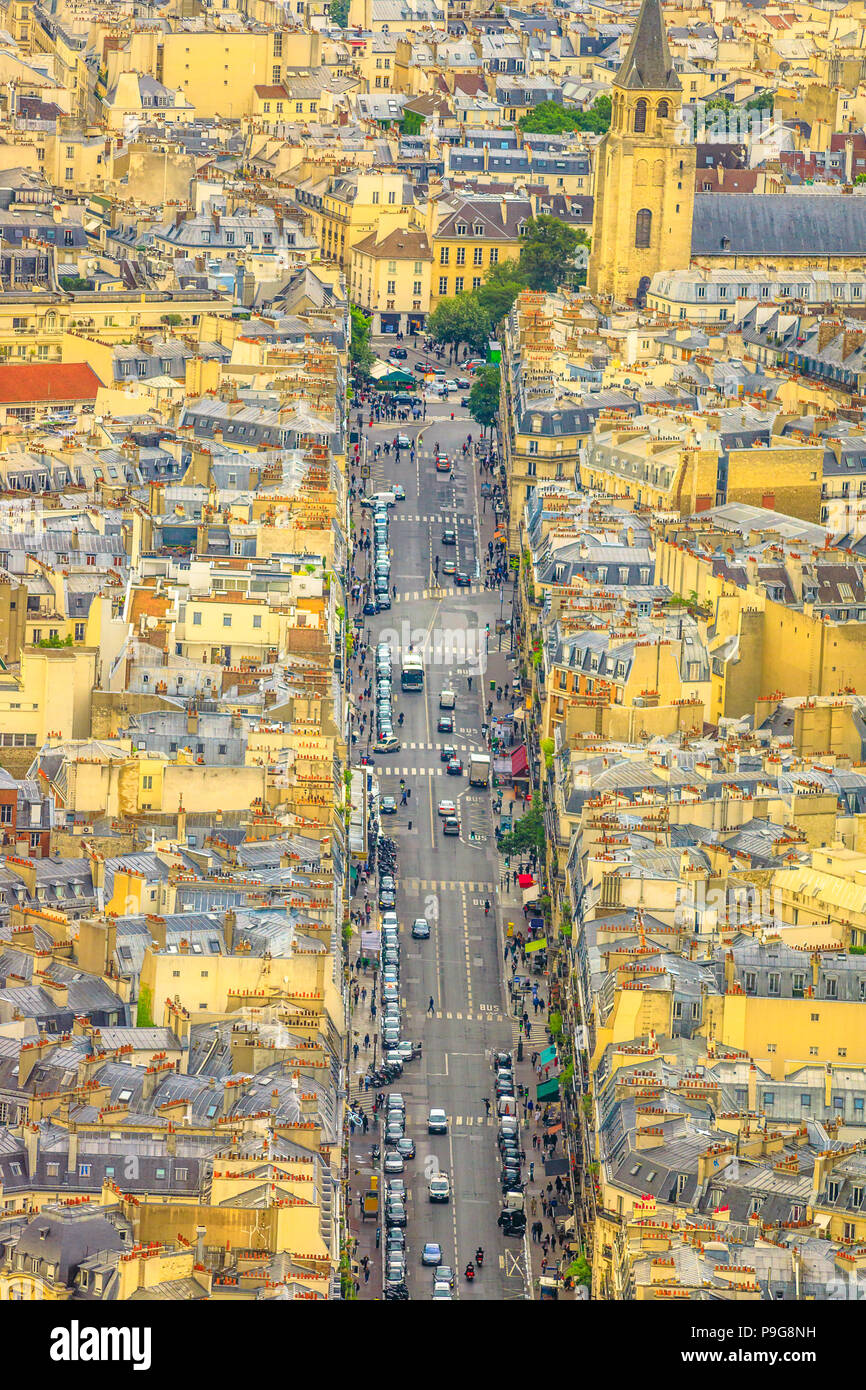 Aerial view of Parisian downtown street from the panoramic overlook from Tour Montparnasse. Paris urban skyline and cityscape. Parisian style architecture of France in Europe. Vertical shot. Stock Photo