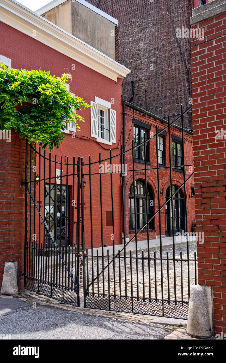 Looking Through Traffic and Pedestrian Geates at Washington Mews, the Oldest Residential  Street in Greenwich Willage, Manhattan, New York City. Stock Photo