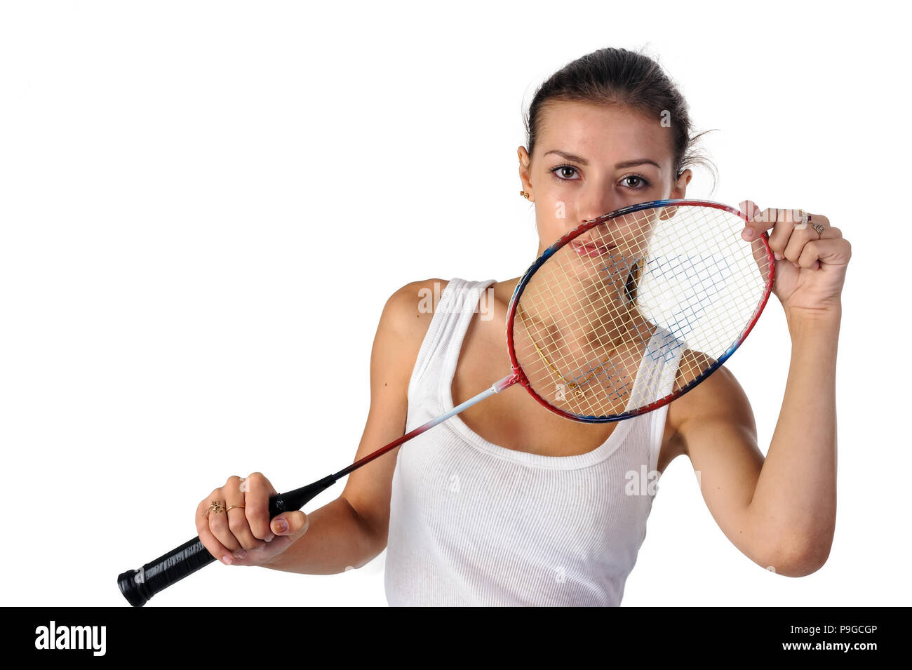 Pretty fit woman holding badminton racket at white background Stock ...