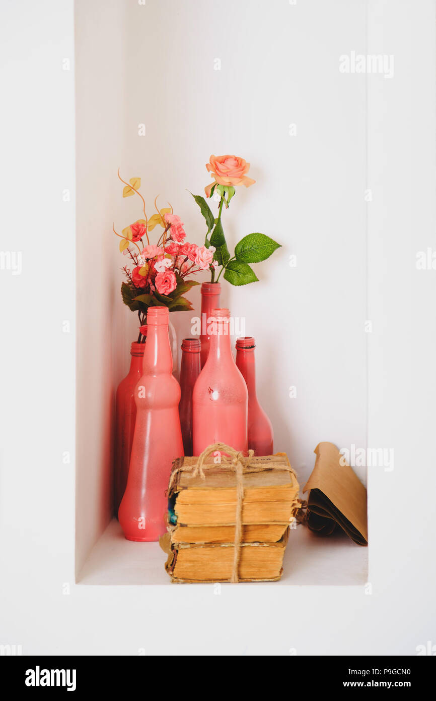 Art Decor White Pink Design Dried Roses In Colored Bottles And Old Vintage Books Stock Photo Alamy