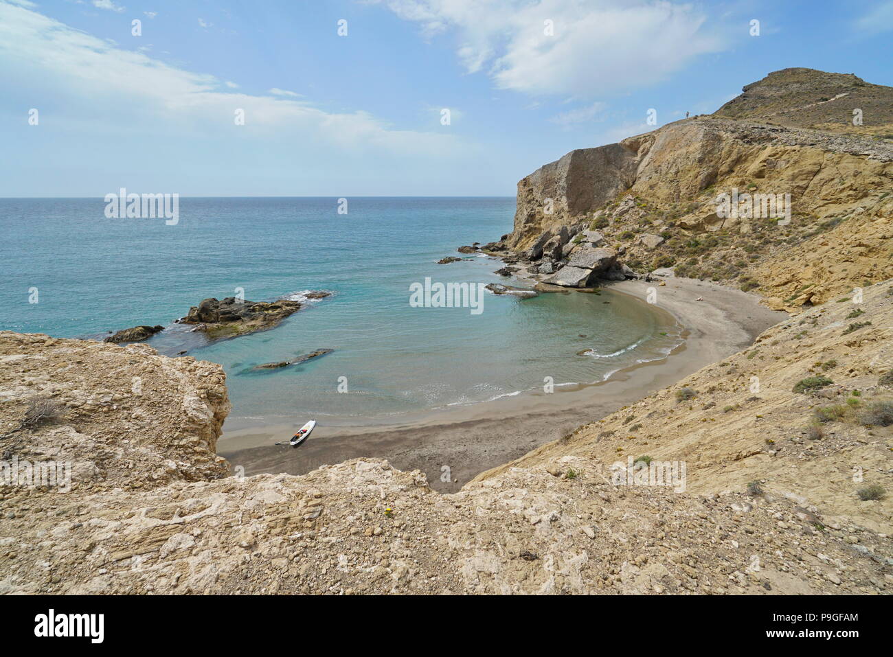 Sandy beach and rocky coast, Cala los Amarillos in the Cabo de Gata-Níjar natural park, Mediterranean sea, Almeria, Andalusia, Spain Stock Photo